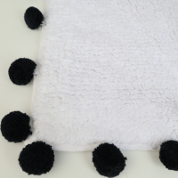 Badmat met pompons zwart